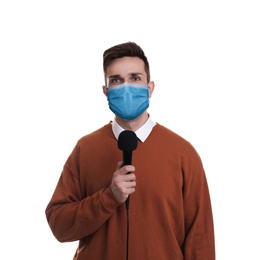 Image of Young journalist with microphone wearing medical mask on white background. Virus protection