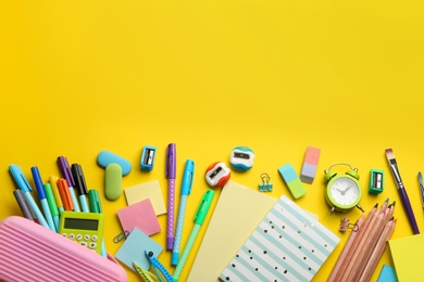 School stationery on yellow background, flat lay with space for text. Back to school