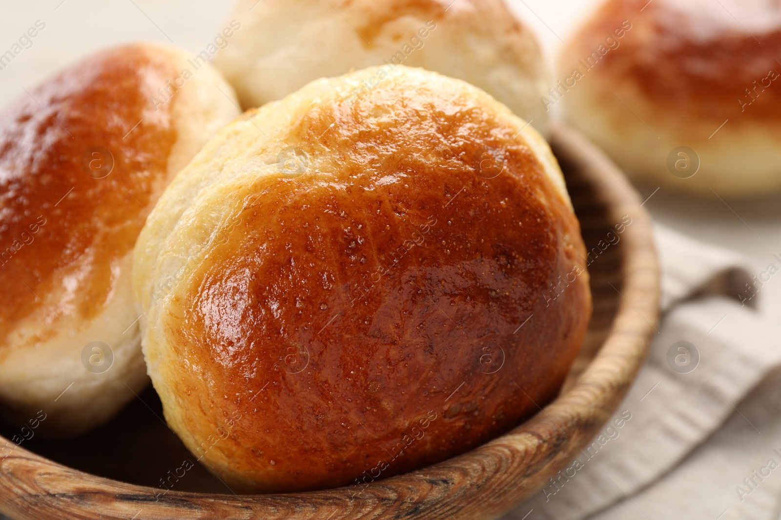 Photo of Freshly baked soda water scones on white table, closeup