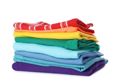Stack of folded clothes on white background