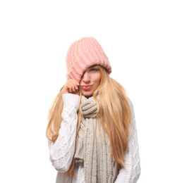 Portrait of emotional young woman in stylish hat and sweater with scarf on white background. Winter atmosphere