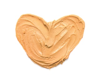 Heart made of peanut butter on white background