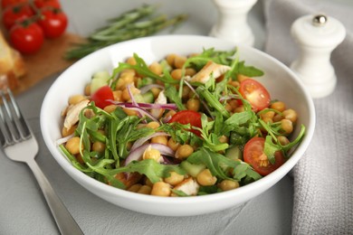 Photo of Delicious fresh chickpea salad on light grey table