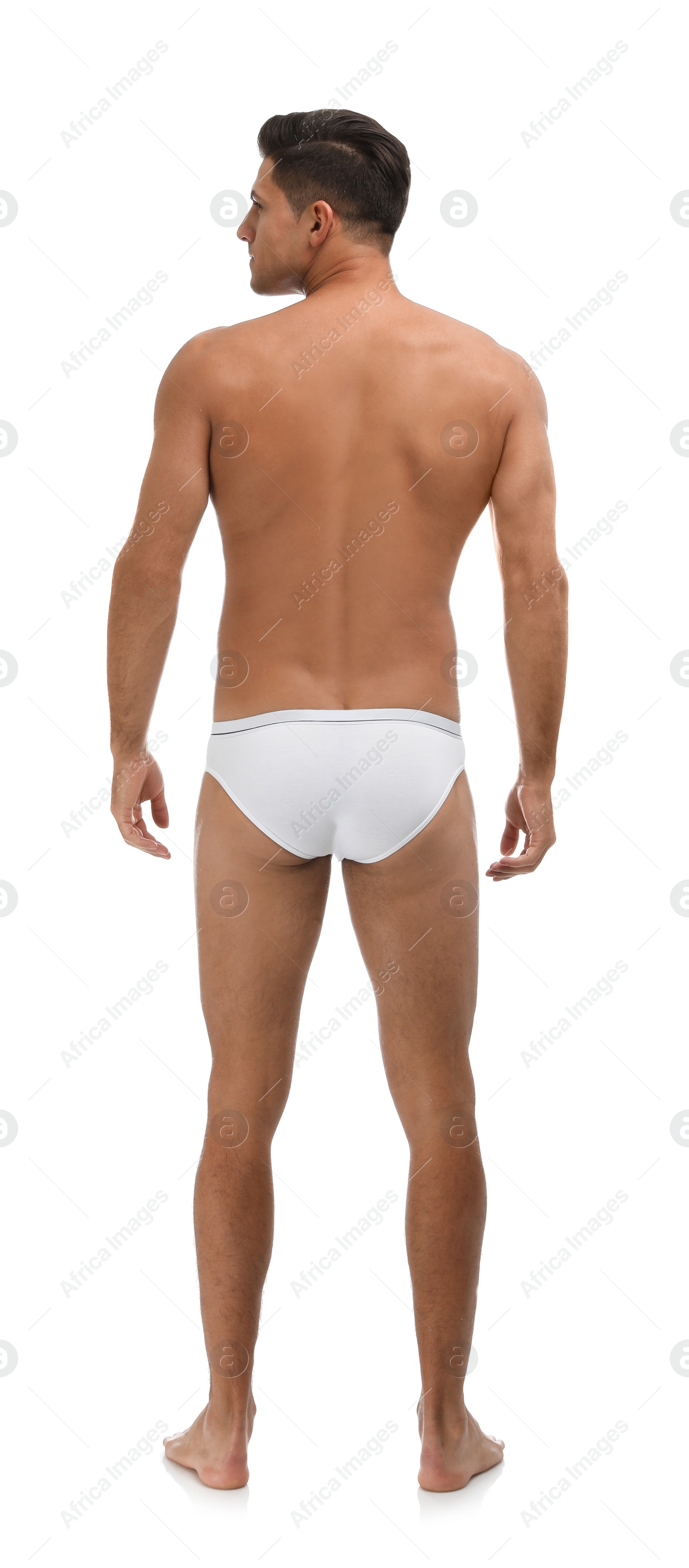 Photo of Handsome man in underwear on white background, back view