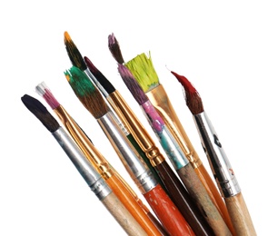 Photo of Different brushes with paints on white background