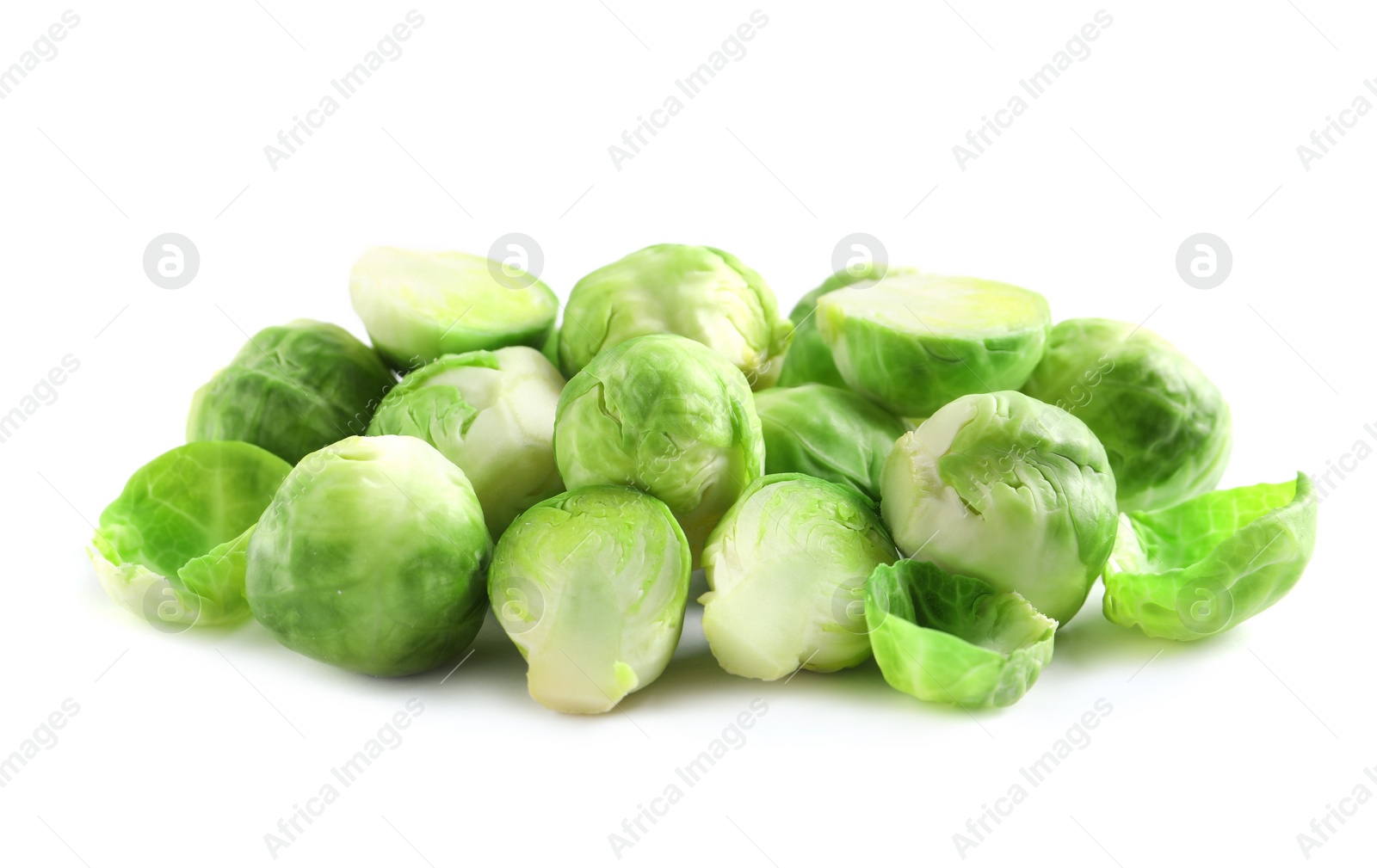 Photo of Pile of fresh Brussels sprouts isolated on white