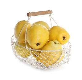 Photo of Fresh ripe quinces in basket on white background