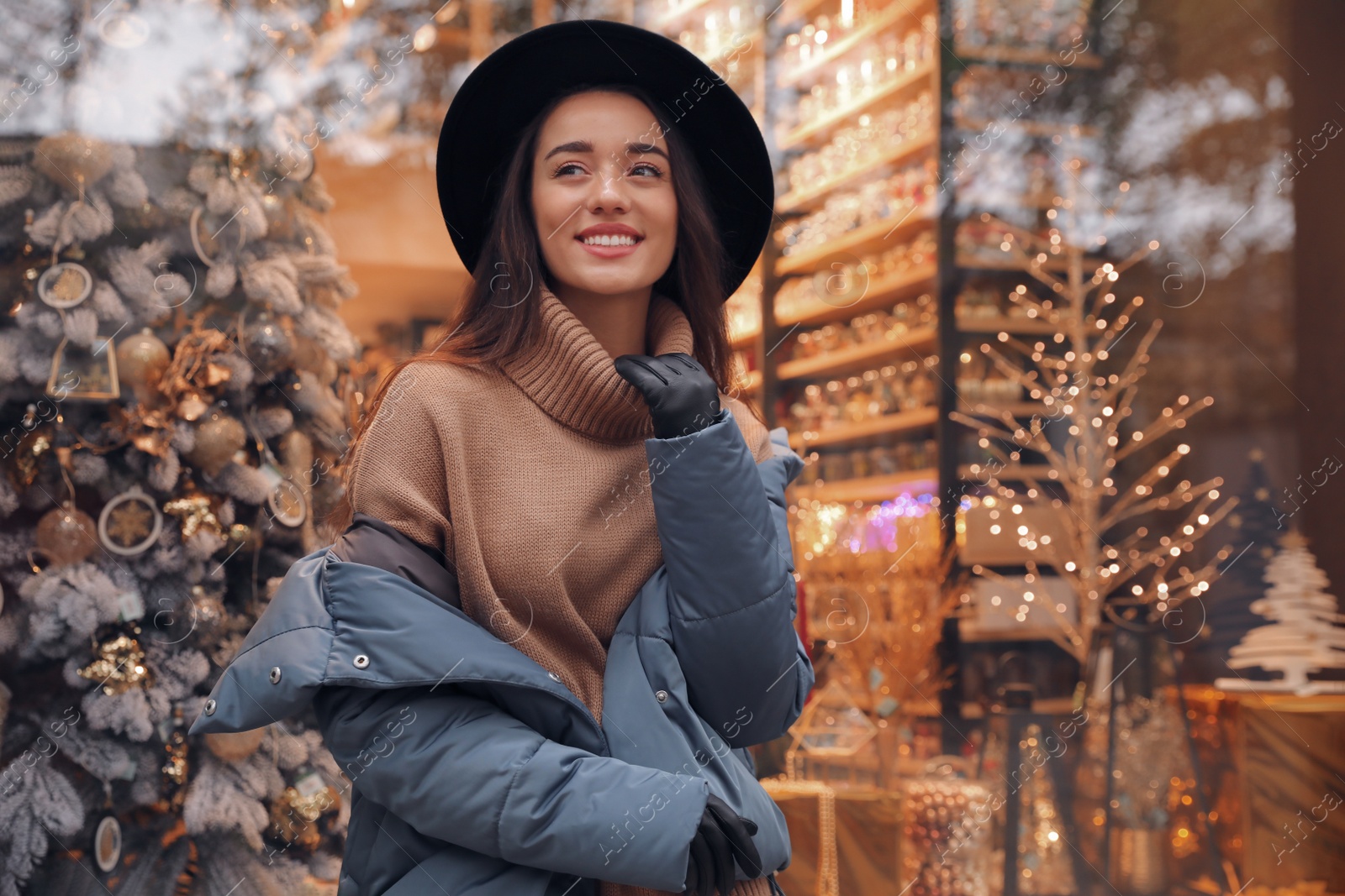 Photo of Young woman wearing stylish clothes outdoors. Autumn look