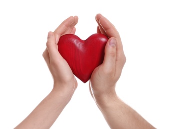 Photo of Man and woman holding decorative heart on white background, closeup