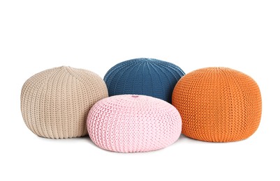 Different stylish poufs on white background. Home design