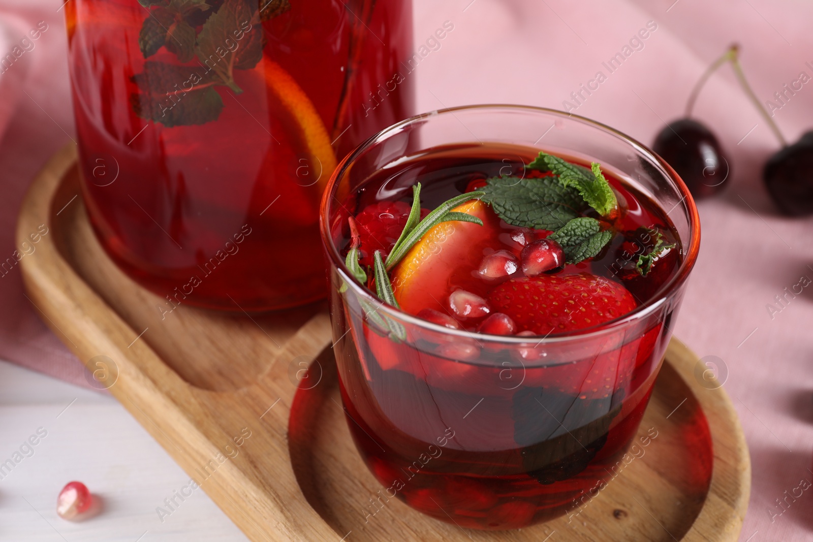 Photo of Delicious refreshing sangria on table, closeup view