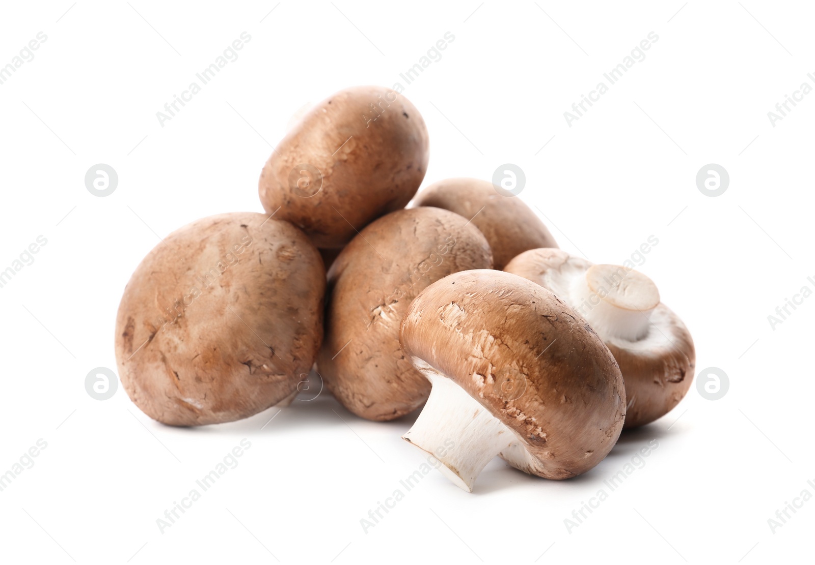 Photo of Fresh champignon mushrooms isolated on white. Healthy food