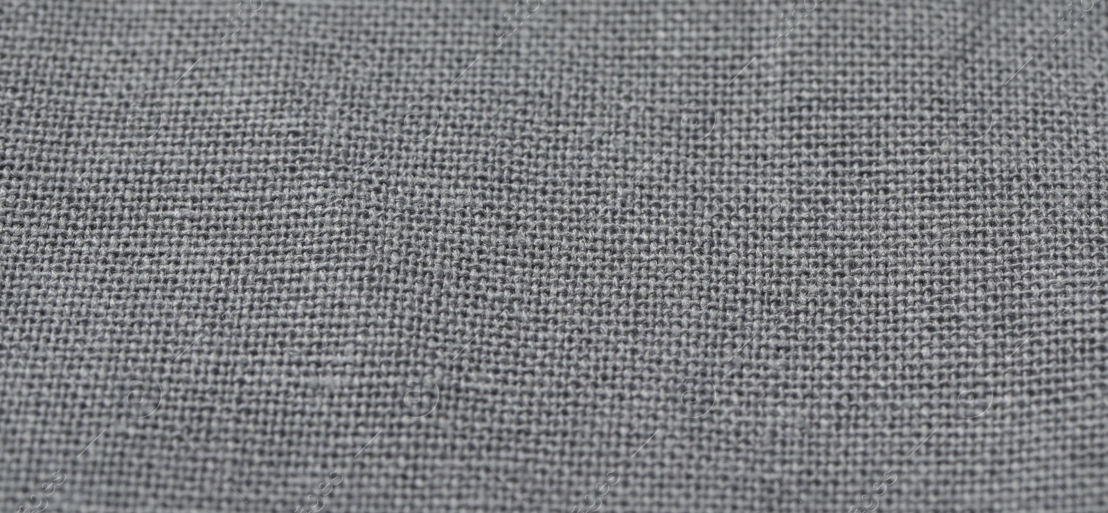 Photo of Texture of grey fabric as background, closeup