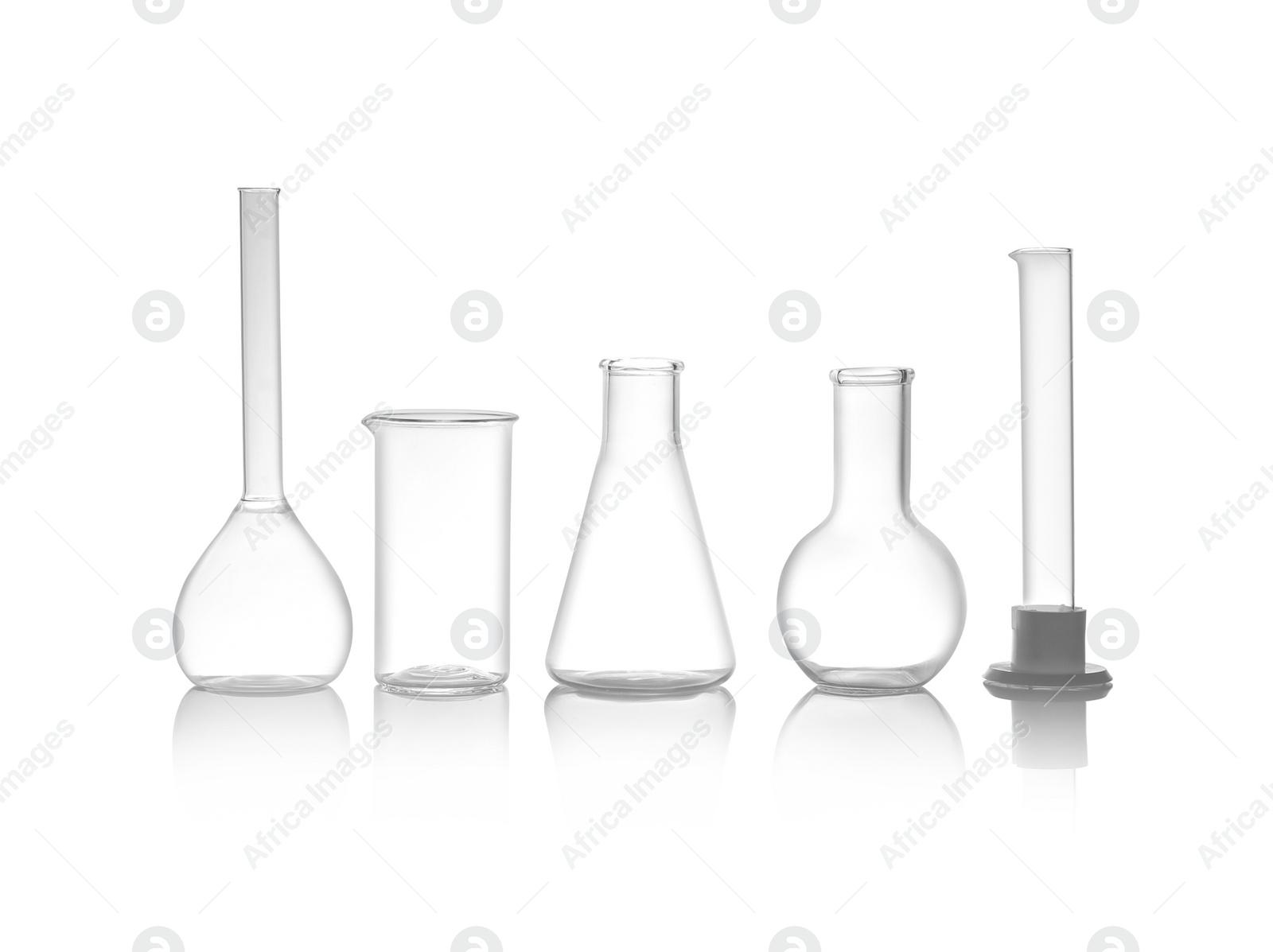 Photo of Clean empty laboratory glassware isolated on white