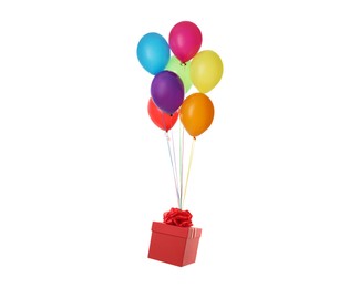 Many balloons tied to red gift box on white background