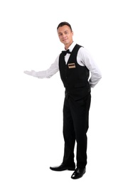 Photo of Full length portrait of young waiter in uniform on white background