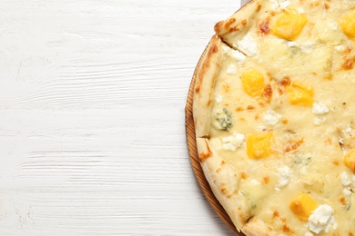 Hot cheese pizza Margherita on white wooden background, top view. Space for text