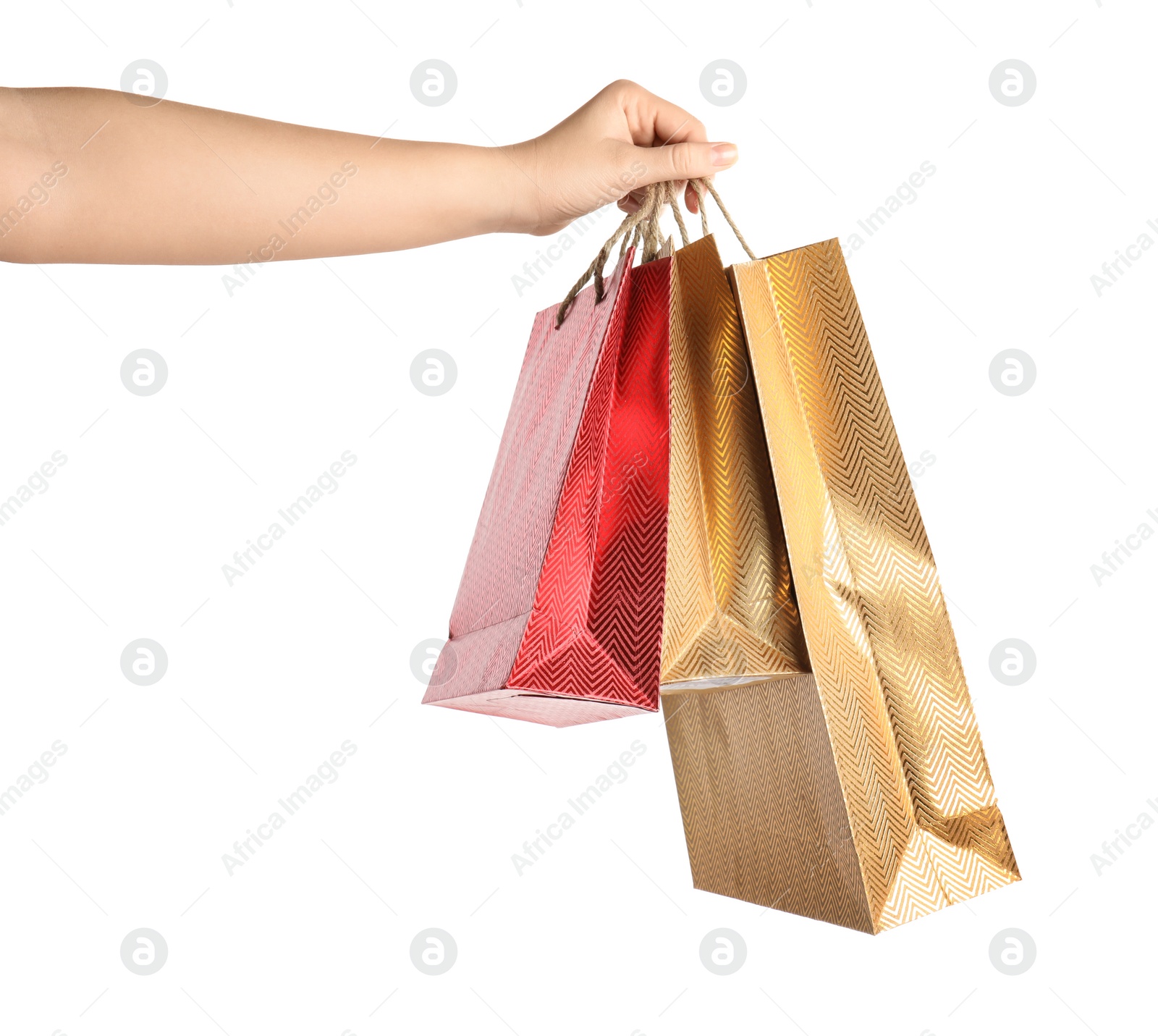 Photo of Woman holding paper shopping bags on white background, closeup