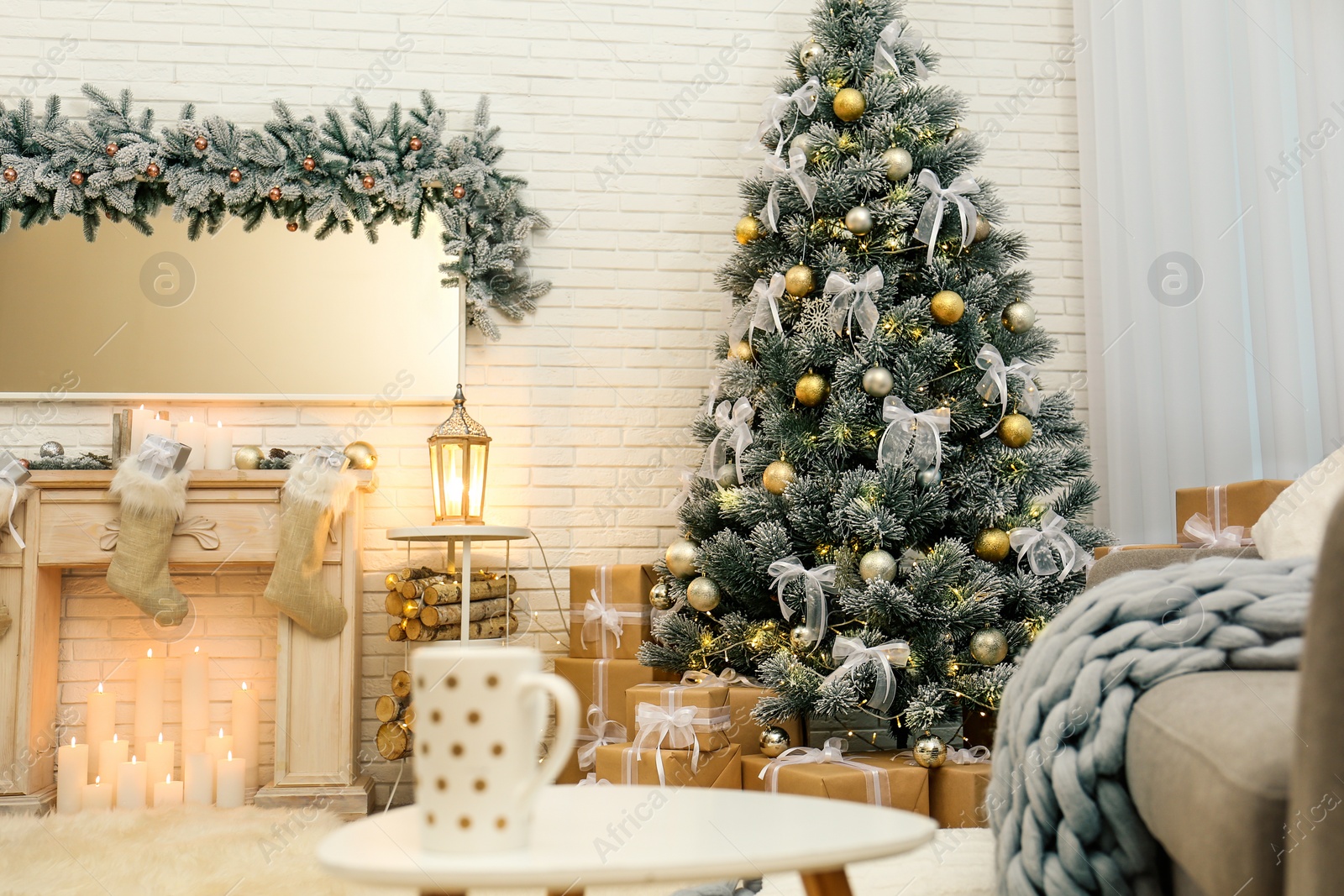 Photo of Decorated Christmas tree in modern living room interior