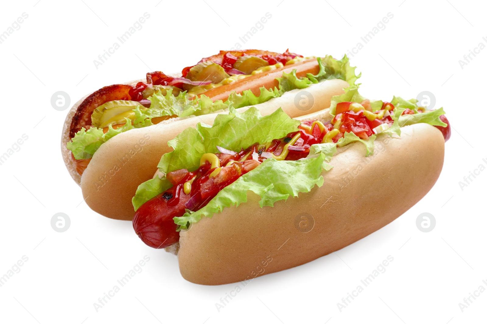 Photo of Tasty hot dogs with different toppings isolated on white