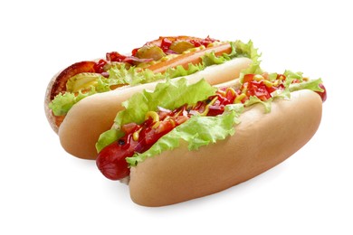 Photo of Tasty hot dogs with different toppings isolated on white