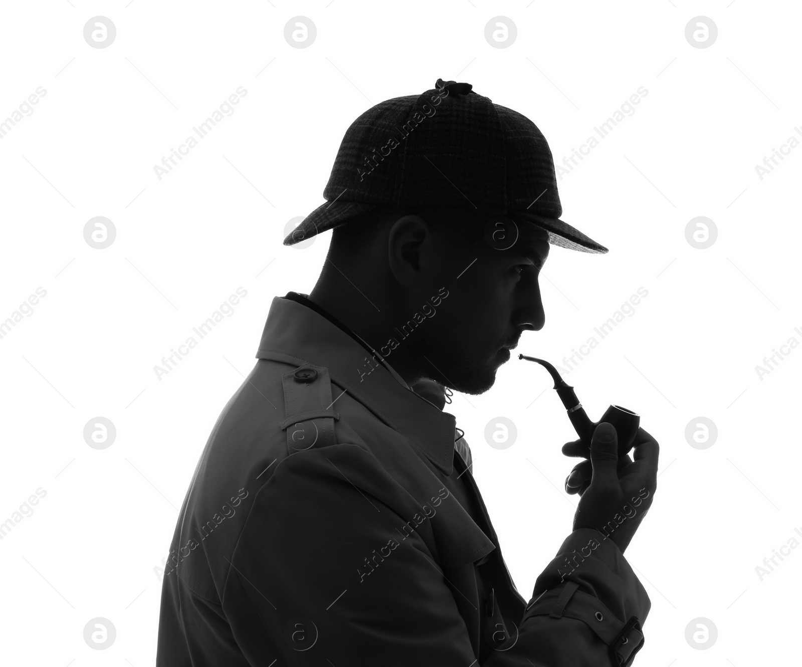 Photo of Old fashioned detective with smoking pipe on white background