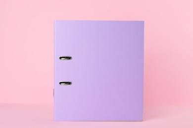 Lilac hardcover office folder on pink background