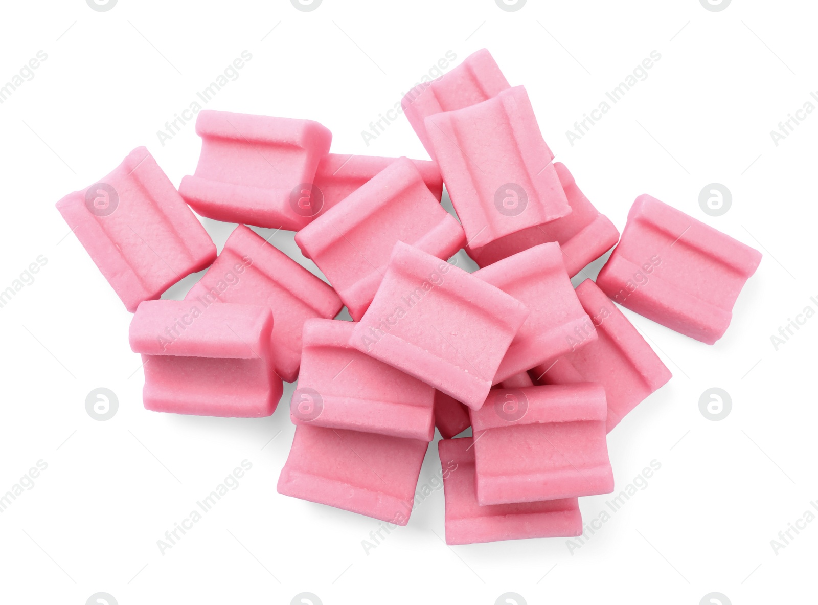 Photo of Pile of tasty pink chewing gums on white background, top view