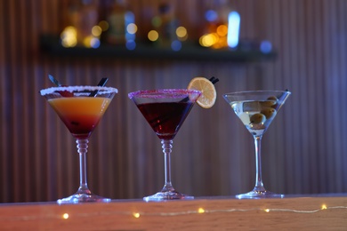 Different martini cocktails on table in bar