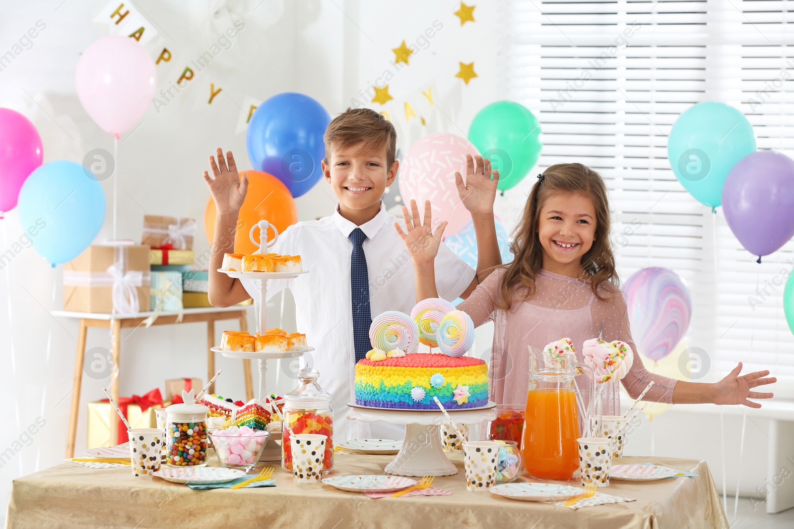 Photo of Happy children at birthday party in decorated room