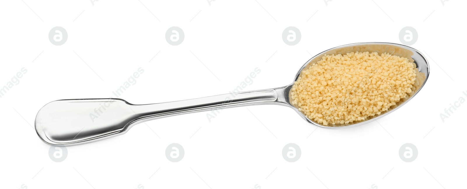 Photo of Spoon with raw couscous on white background, top view
