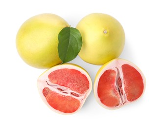 Photo of Tasty whole and cut pomelo fruits isolated on white, top view