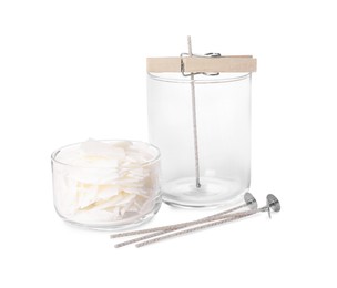 Photo of Wicks, wax flakes and jar with clothespin as stabilizer on white background. Making homemade candle