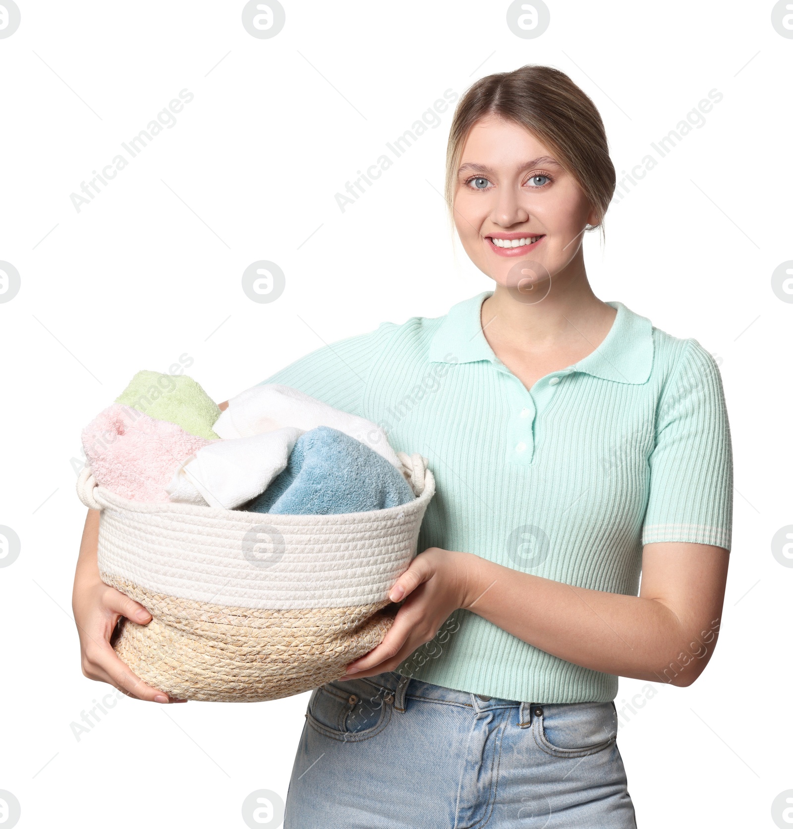 Photo of Happy woman with basket full of laundry on white background