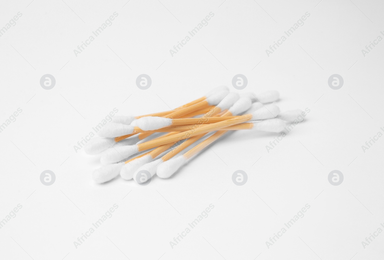 Photo of Pile of clean cotton buds isolated on white