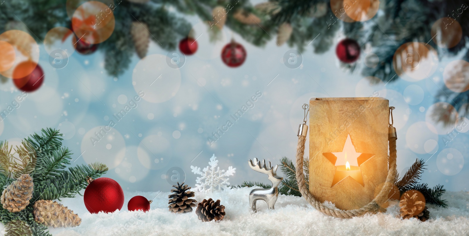 Image of Composition with wooden Christmas lantern on snow against color background, banner design. Bokeh effect