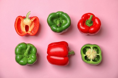 Flat lay composition with raw ripe paprika peppers on color background