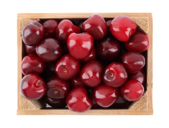 Photo of Tasty ripe red cherries in wooden crate isolated on white, top view