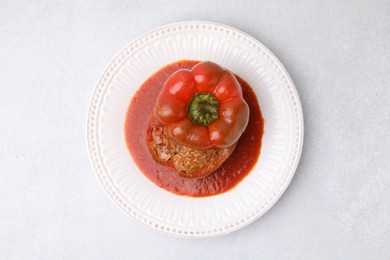 Photo of Delicious stuffed bell pepper on light table, top view