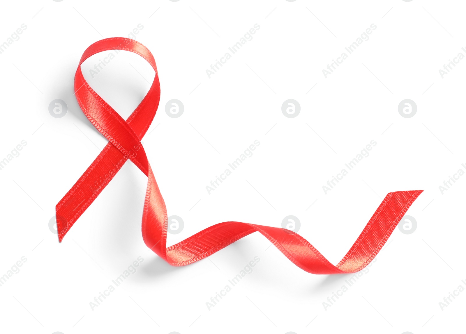 Photo of Red ribbon on white background, top view. Cancer awareness