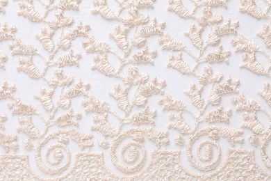 Photo of Beautiful beige lace as background, top view