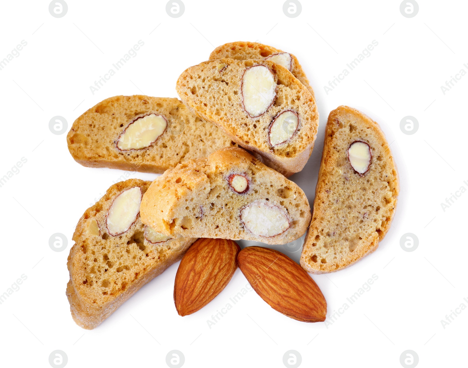 Photo of Slices of tasty cantucci and nuts on white background, top view. Traditional Italian almond biscuits