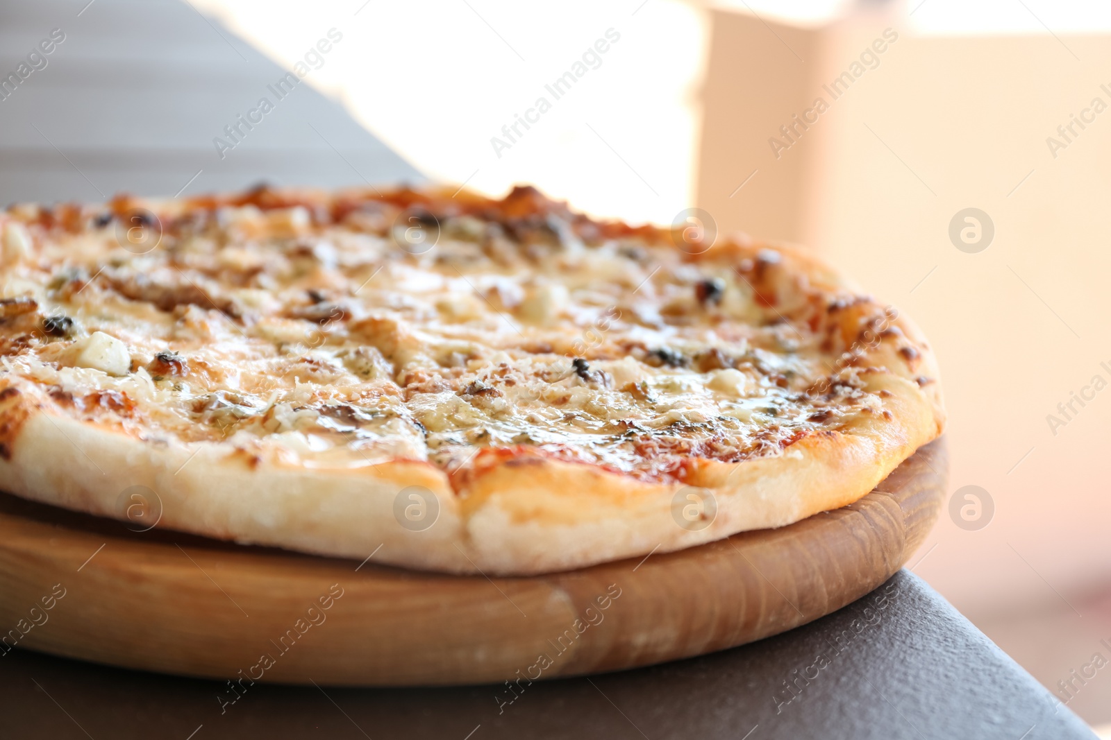 Photo of Delicious fresh pizza on table outdoors, closeup