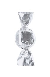 Photo of Tasty candy in silver wrapper isolated on white