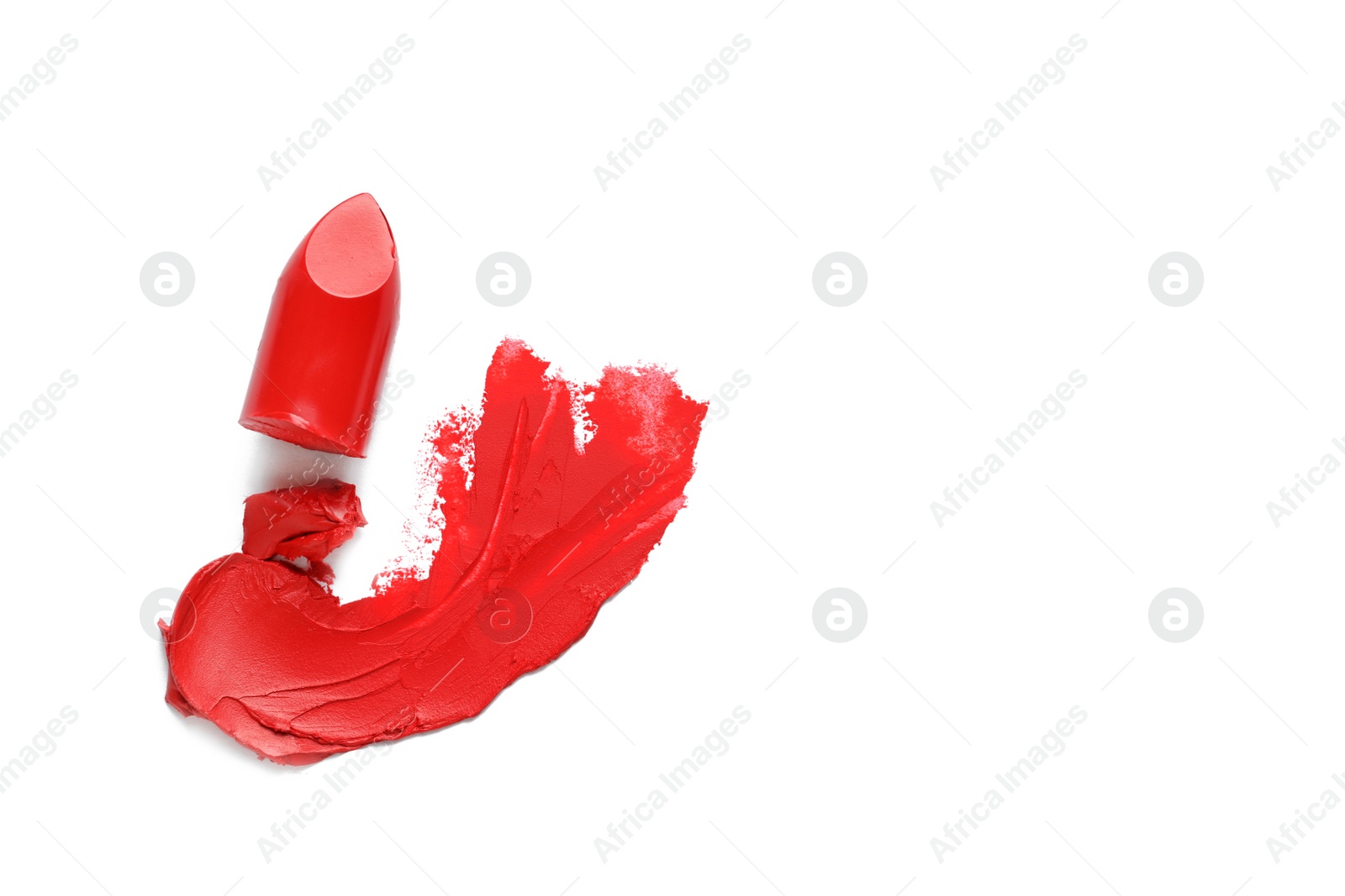 Photo of Stroke and lipstick on white background, top view