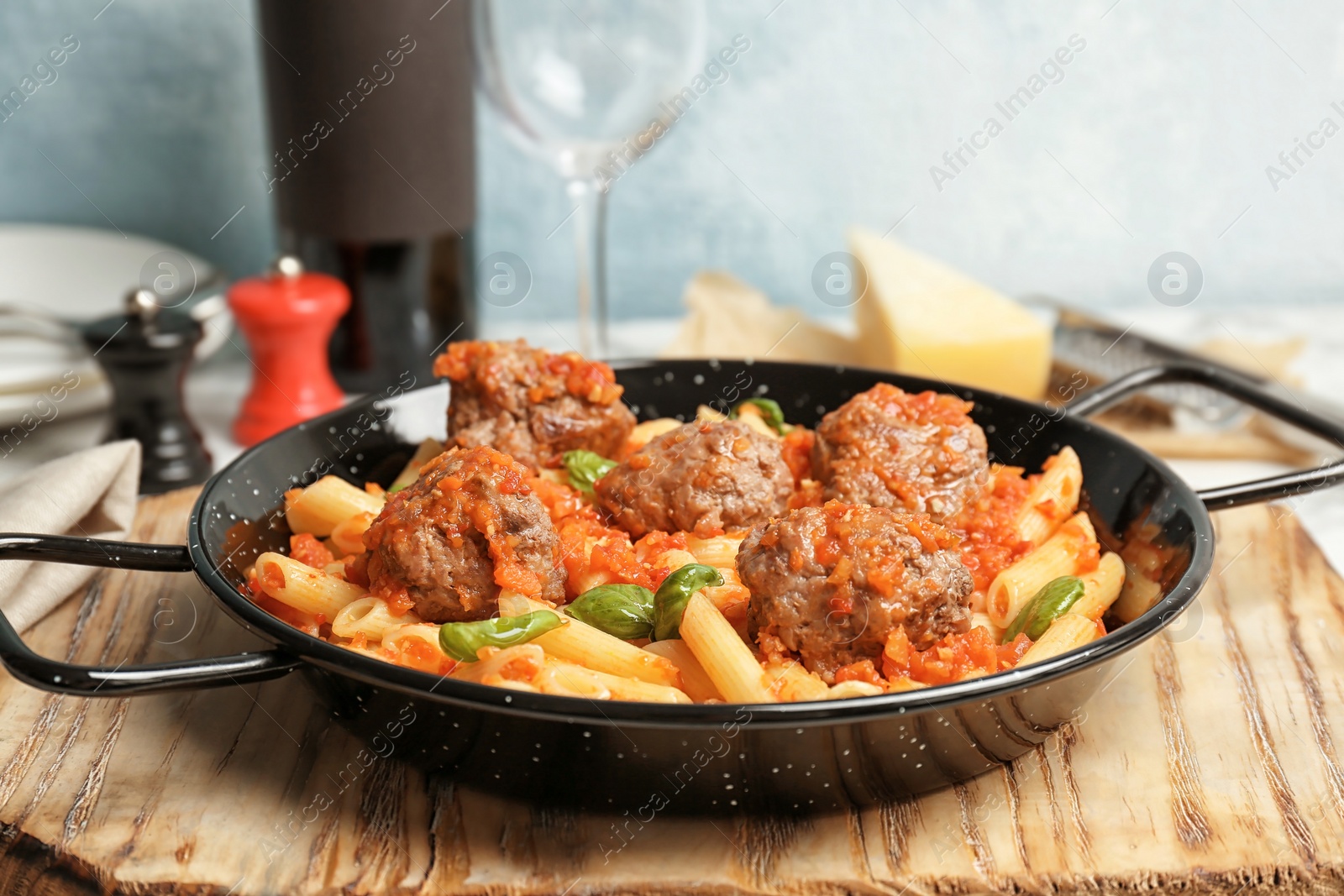 Photo of Pasta with meatballs and tomato sauce on table