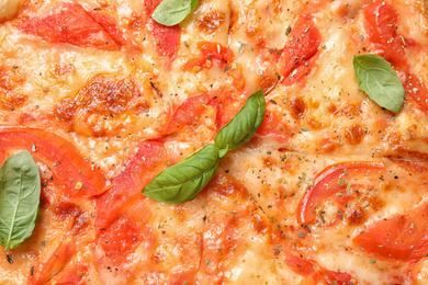 Delicious pizza Margherita as background, closeup view