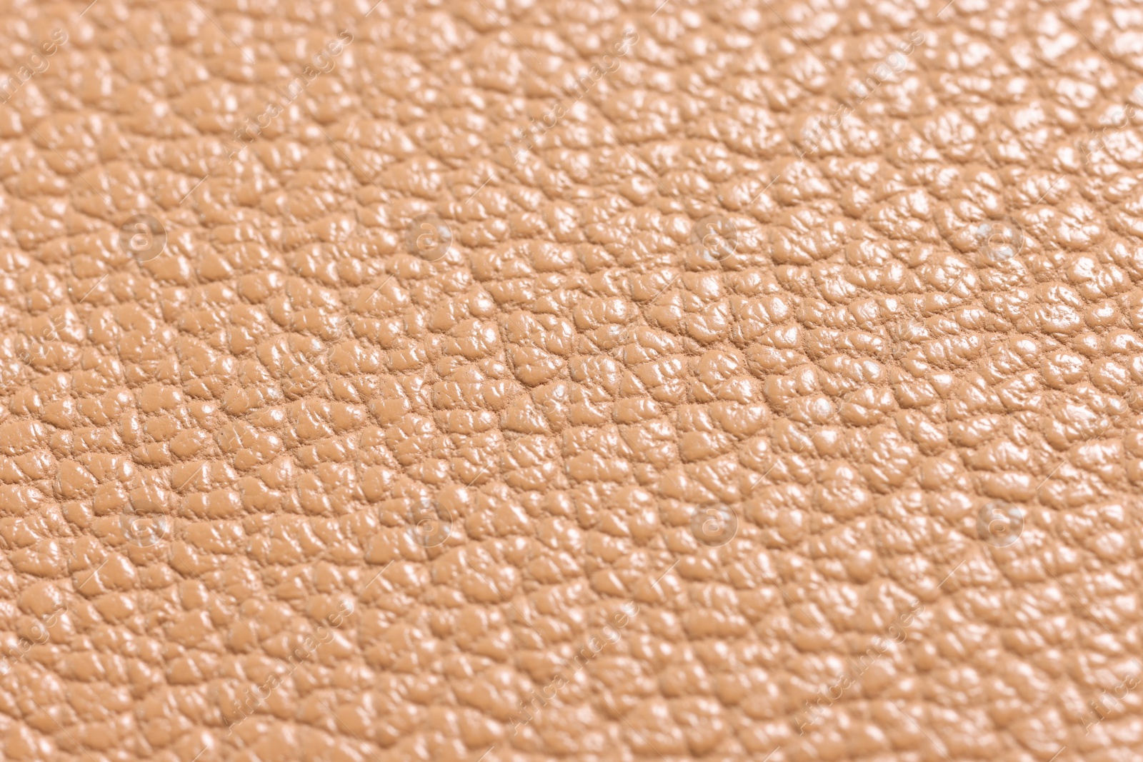 Photo of Light brown natural leather as background, closeup view