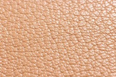 Photo of Light brown natural leather as background, closeup view