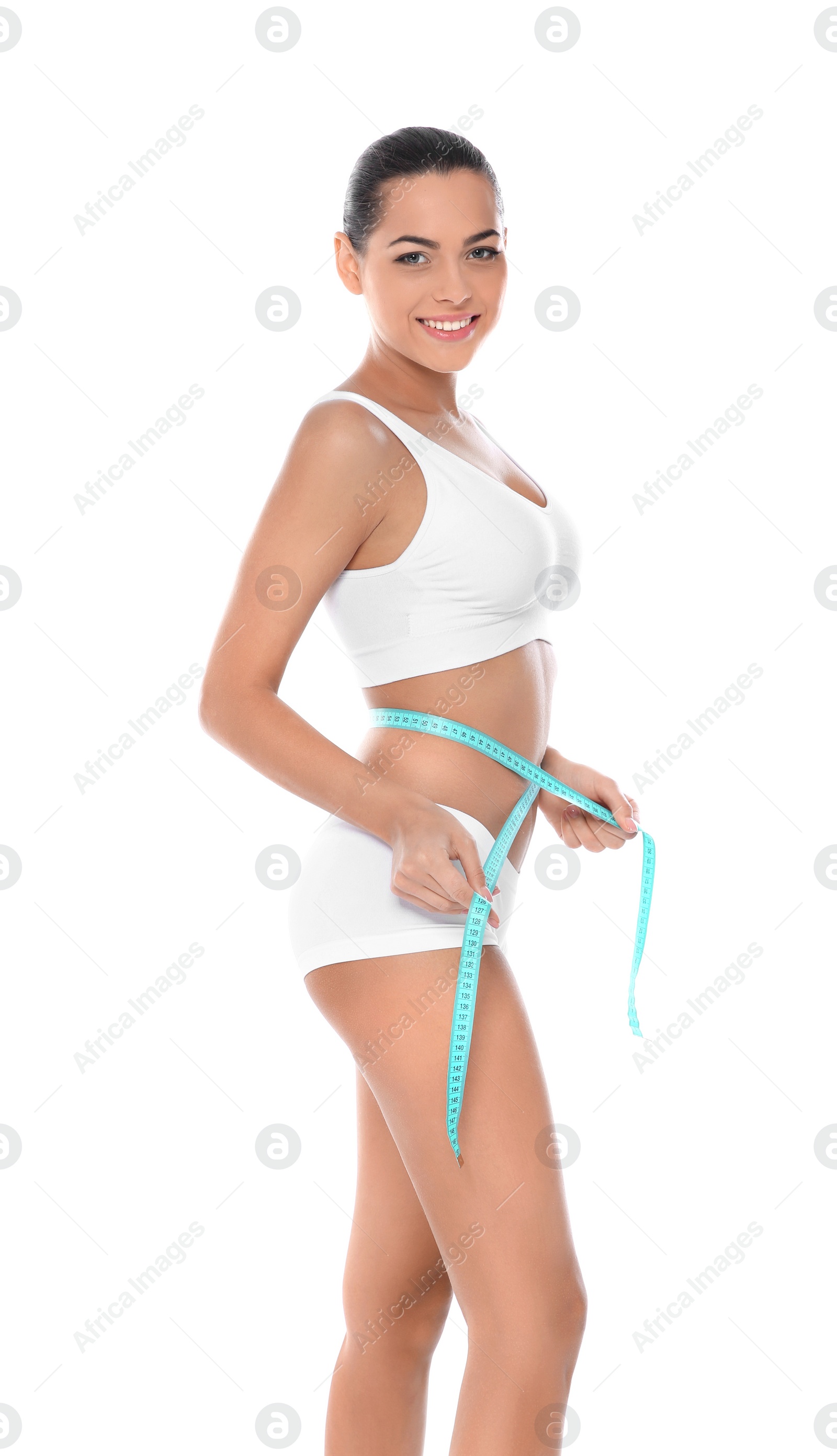 Photo of Slim woman measuring her waist on white background. Weight loss